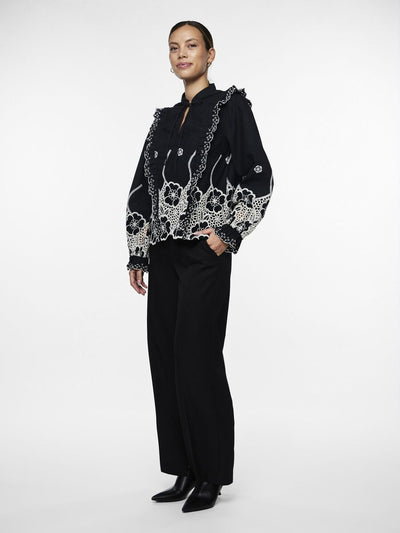 Black blouse with white embroidery
